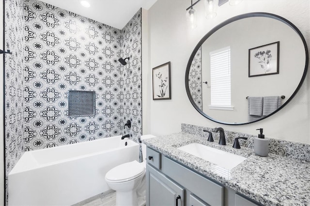 bathroom with toilet,  shower combination, and vanity