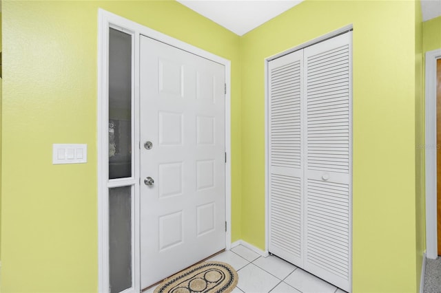 foyer with light tile patterned flooring