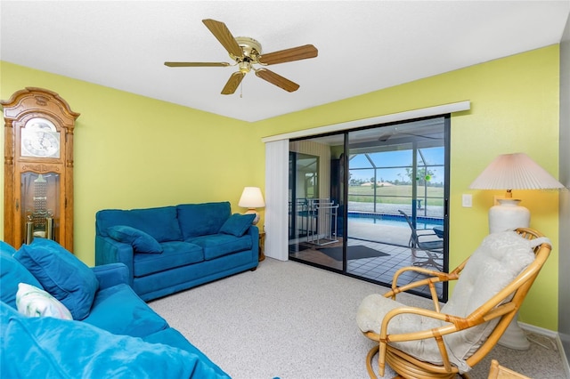 living area with carpet flooring and a ceiling fan