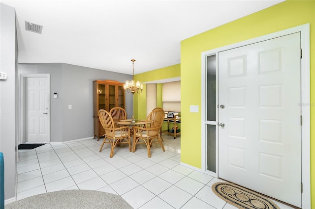 dining area featuring visible vents, baseboards, a chandelier, and light tile patterned flooring