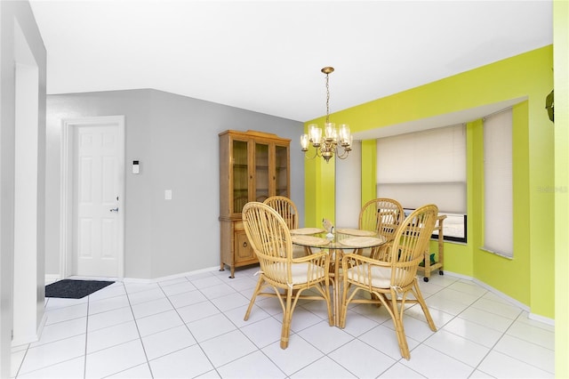 dining space featuring a chandelier, light tile patterned floors, and baseboards