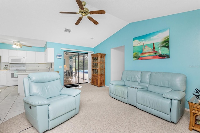 living room with vaulted ceiling, light carpet, visible vents, and ceiling fan