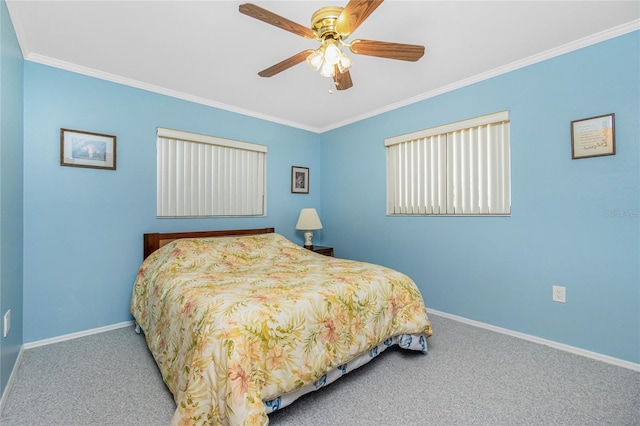 carpeted bedroom featuring ceiling fan, crown molding, and baseboards