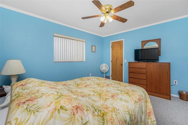 bedroom with crown molding, carpet flooring, a ceiling fan, and baseboards