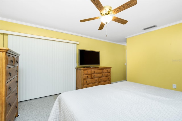 bedroom with visible vents, a ceiling fan, crown molding, and carpet