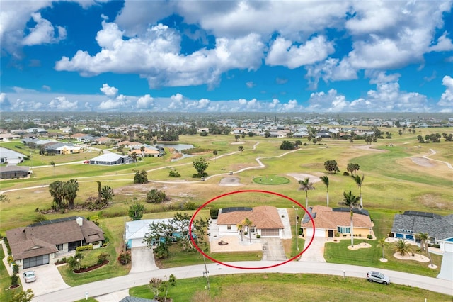 aerial view with golf course view and a residential view