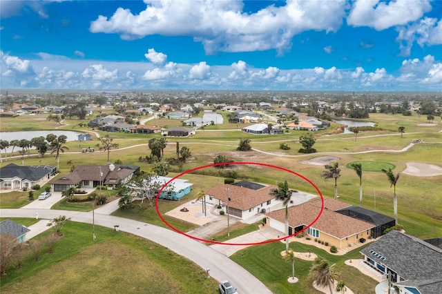 birds eye view of property featuring golf course view and a residential view