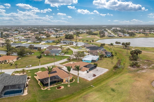 birds eye view of property with a residential view and a water view