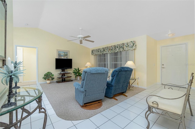 living room with light tile patterned flooring, baseboards, ceiling fan, and vaulted ceiling