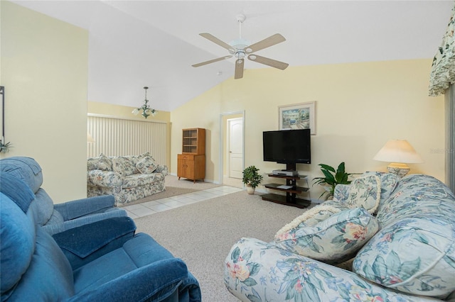 living area featuring tile patterned floors, a ceiling fan, and lofted ceiling