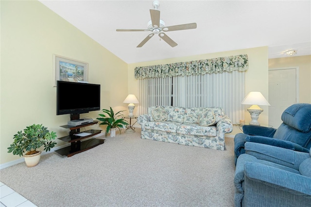 living area with carpet flooring, baseboards, ceiling fan, and vaulted ceiling