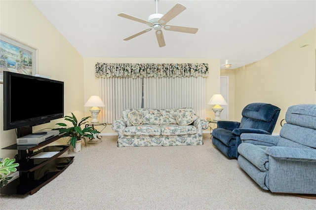 living room with vaulted ceiling, carpet, and ceiling fan