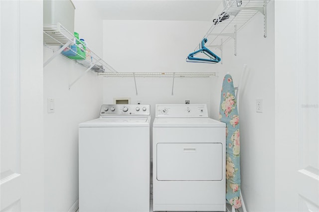 laundry area with laundry area and washing machine and clothes dryer