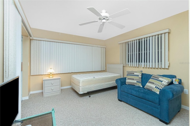 bedroom with baseboards, carpet floors, and ceiling fan