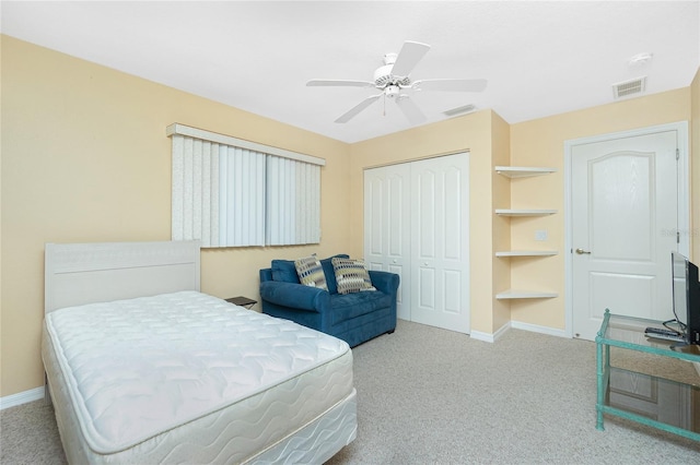 bedroom featuring carpet flooring, baseboards, visible vents, and a closet