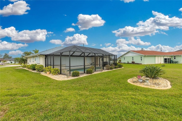 view of yard featuring an outdoor pool and glass enclosure