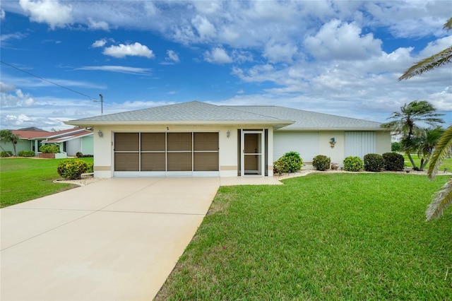 single story home with a garage, concrete driveway, a front yard, and stucco siding