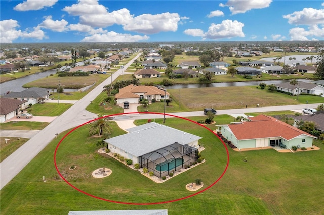 aerial view with a residential view and a water view