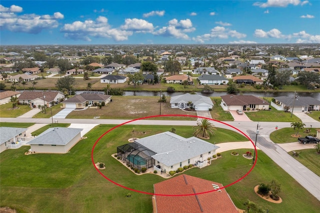 aerial view with a residential view and a water view