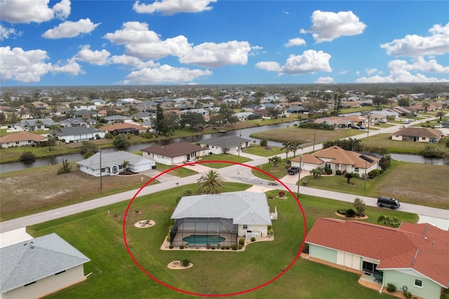 aerial view featuring a residential view and a water view