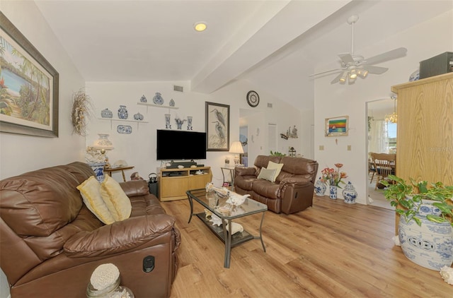 living area featuring visible vents, light wood-style flooring, lofted ceiling with beams, and ceiling fan