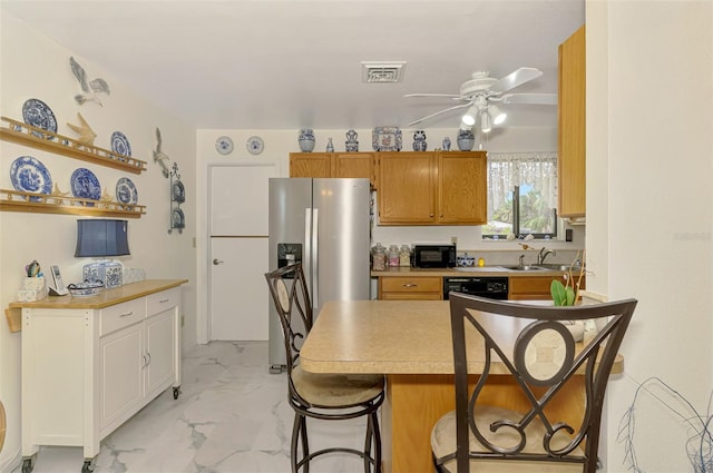 kitchen featuring visible vents, dishwasher, stainless steel refrigerator with ice dispenser, marble finish floor, and a sink