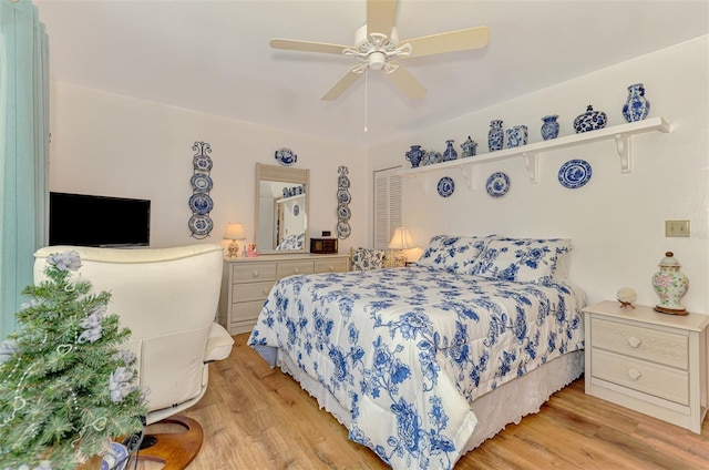 bedroom featuring ceiling fan and light wood-style flooring