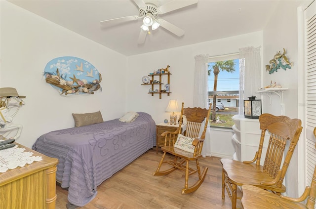 bedroom with wood finished floors and a ceiling fan