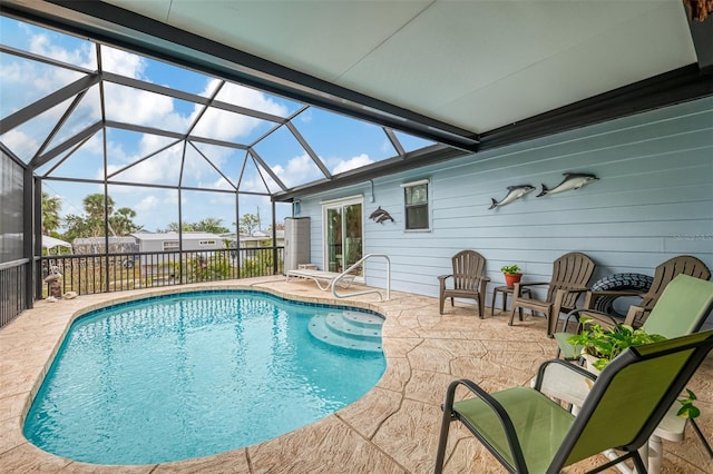 view of pool with a patio, a fenced in pool, and a lanai