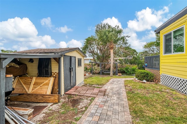 view of yard with an outdoor structure and a storage unit