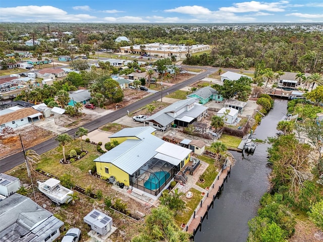 birds eye view of property with a residential view and a water view