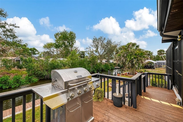 1173 Brown St, Englewood, FL 34224 - wooden terrace with a grill and a water view
