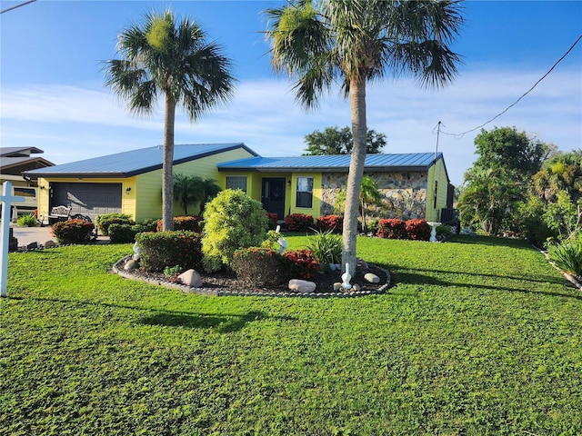 1173 Brown St, Englewood, FL 34224 - ranch-style house with a front yard and an attached garage