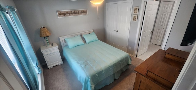 bedroom featuring light colored carpet