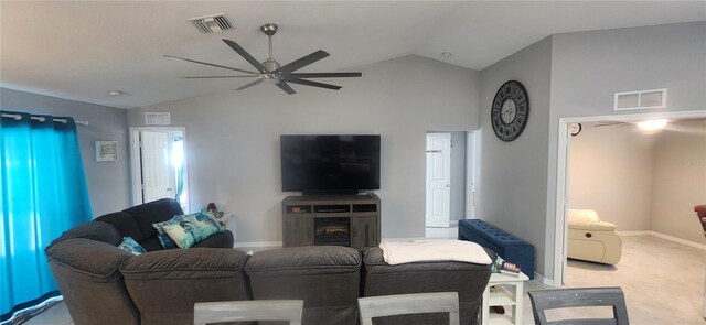 carpeted living room featuring lofted ceiling, a ceiling fan, and visible vents