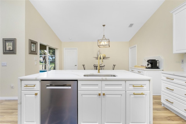 kitchen featuring visible vents, lofted ceiling, a sink, light wood-style floors, and dishwasher