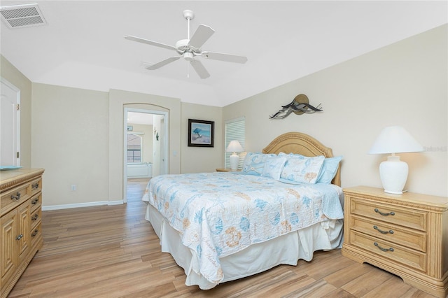 bedroom with visible vents, a ceiling fan, light wood-type flooring, and baseboards