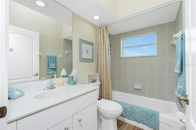 full bathroom with toilet, recessed lighting, shower / tub combo, wood finished floors, and vanity