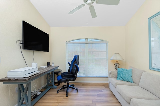 office area with baseboards, wood finished floors, and a ceiling fan