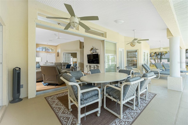 view of patio with outdoor dining area and ceiling fan