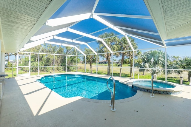 view of pool featuring glass enclosure, a patio area, and a pool with connected hot tub