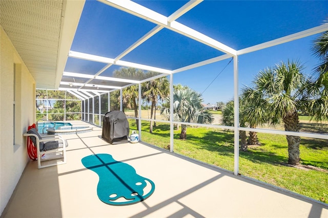 exterior space with an outdoor pool, glass enclosure, and an in ground hot tub