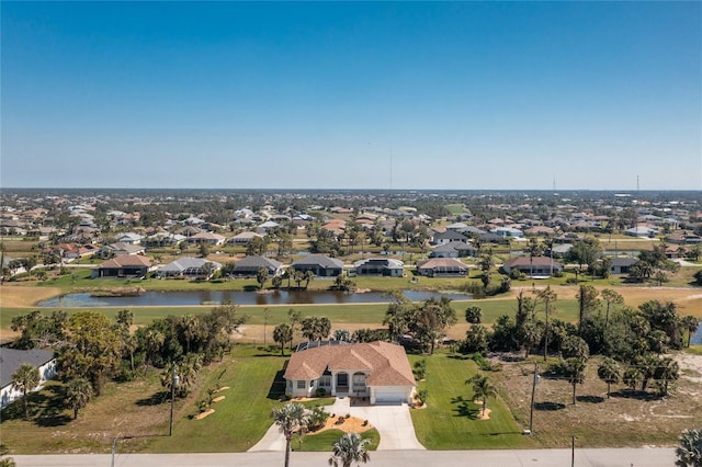 bird's eye view featuring a residential view and a water view