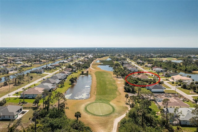 drone / aerial view featuring a residential view and a water view