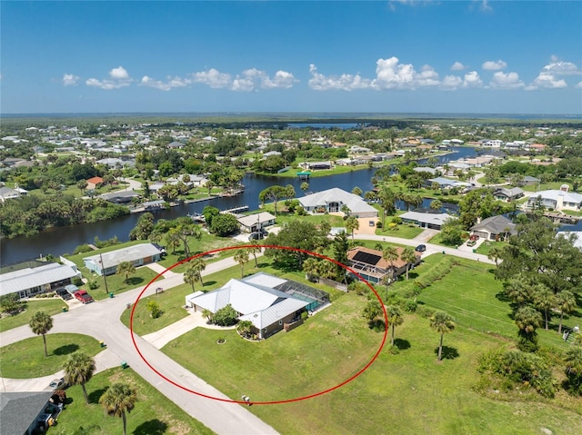 birds eye view of property featuring a residential view and a water view