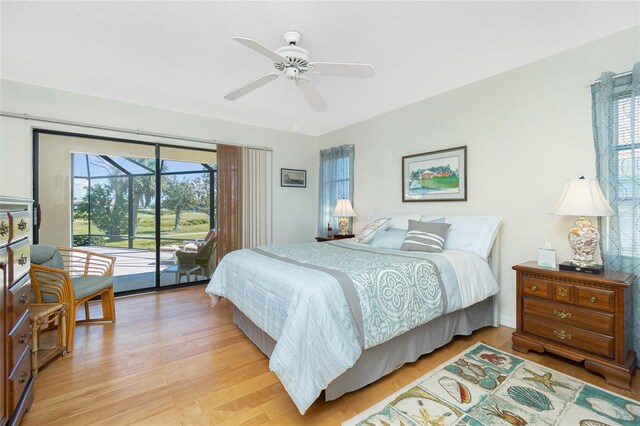 bedroom featuring a sunroom, access to exterior, a ceiling fan, and light wood finished floors