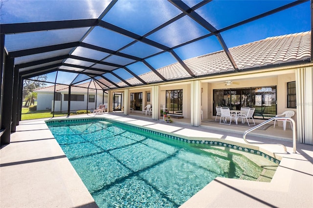 pool featuring a lanai and a patio area