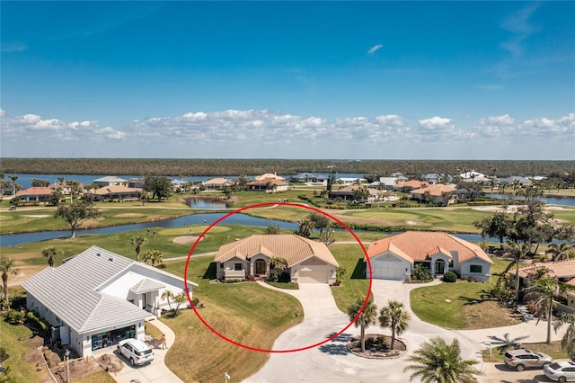 bird's eye view with a residential view and a water view