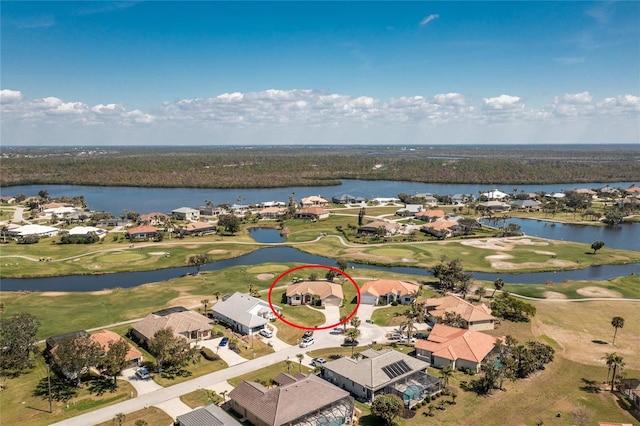 drone / aerial view featuring a residential view, a water view, and view of golf course