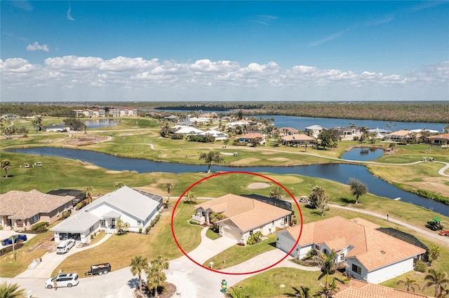 bird's eye view featuring view of golf course, a water view, and a residential view